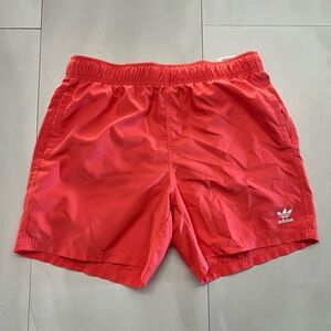 Men’s XL Adidas pink (salmon) swim trunks with pockets… has briefs Inside